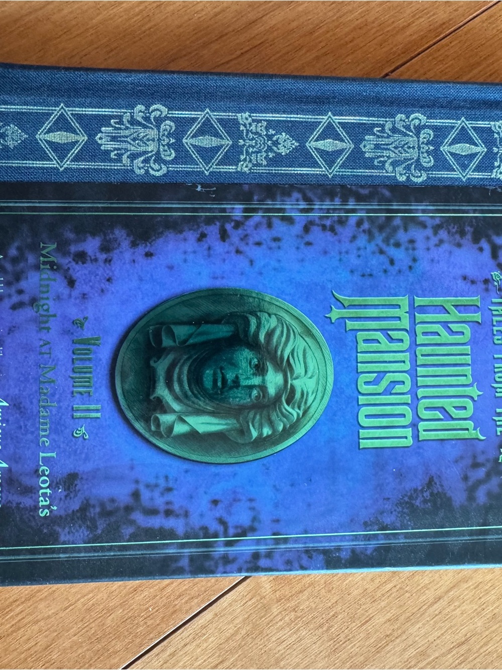 Disney Haunted Mansion Hardcover Coffee Table Book in Blue and Green